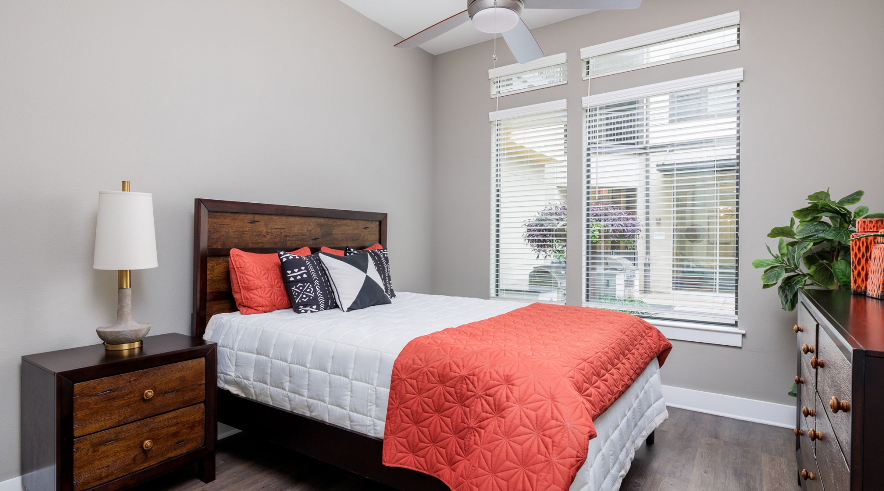 Bedroom with hardwood floors and double window