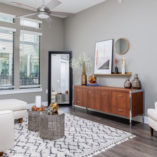 Living room with bright window and grey walls