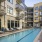 a pool in a courtyard between buildings