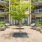 a group of plants and trees outside a building