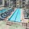 a pool in a courtyard between buildings